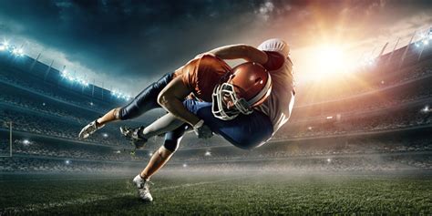 American Football Player Being Tackled Stock Photo Download Image Now