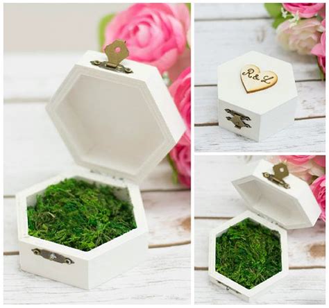 Twigs, moss and two bird eggs make up this enchanting ring holder that your ring bearer and guests are sure to love. Moss Ring Pillow Wooden Ring Box Wedding Ring Holder ...