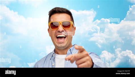 Face Of Laughing Man In Sunglasses Pointing To You Stock Photo Alamy