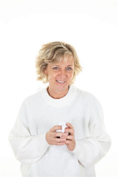 Senior Cheerful Sixty Year Old Blonde Mature Woman Holding Coffee Mug Hot Drink With Blue Eyes