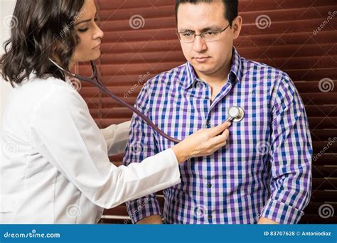 Doctor Using A Stethoscope On Patient Stock Photo Image Of Examining