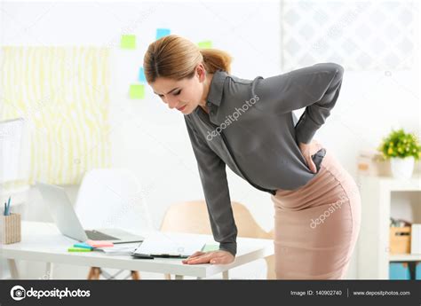 Woman Suffering From Backache — Stock Photo © Belchonock 140902740