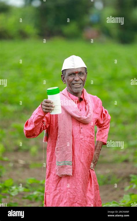Indian Happy Farmer Holding Empty Bottle In Hands Happy Farmer Showing