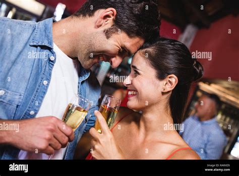 Couple Enjoying Champagne In Nightclub Stock Photo Alamy