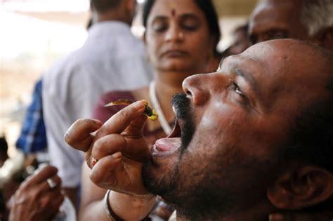 Indian Believers Swallow Live Fish As Asthma Cure Photo Pictures CBS News