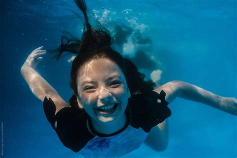 Young Preteen Girl Having Fun Swimming In A Pool Underwater By