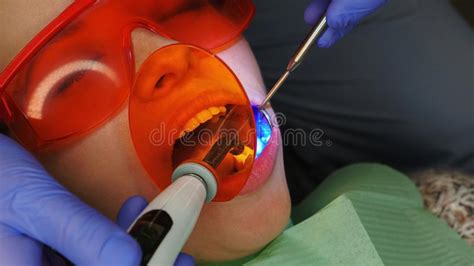 Close Up Of Woman Mouth With Bleeding Gums During Teeth Brushing