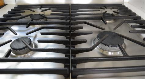 Once both the coils and drip pans are clean, fit the drip pans back into their place on your stove. How to Clean the Cast Iron Grate of a Gas Stove Without ...