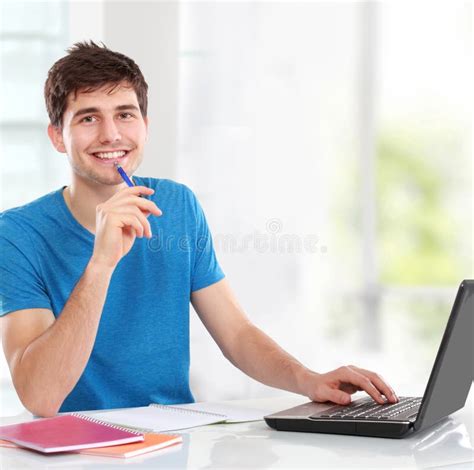 College Student Using His Laptop Stock Photo Image Of Book Indoors