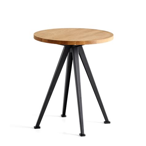 It features a wooden top, which will give your room aesthetic allure by adding a touch of organic beauty. Pyramid Coffee Table 51 by Hay | Connox