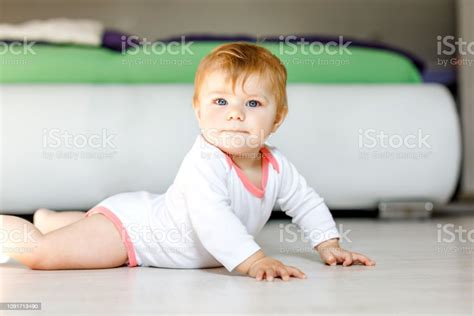 Little Cute Baby Girl Learning To Crawl Healthy Child Crawling In Kids