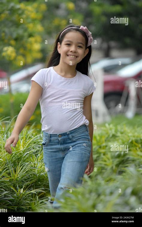 A Happy Female Tween Walking Stock Photo Alamy