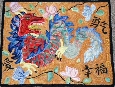 a rug with a dragon on it and chinese writing in the middle, along with