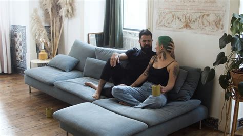 Couple Talking While Sitting On Sofa · Free Stock Video