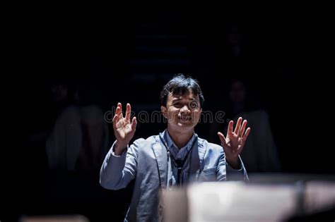 Conductor Is Leading An Orchestra With His Hand Gestures Editorial