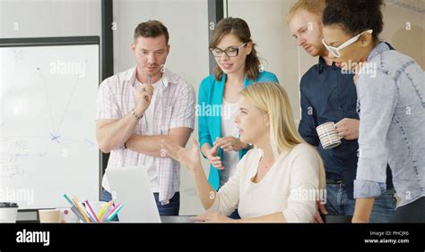 Young People Brainstorming In Office Stock Photo Alamy