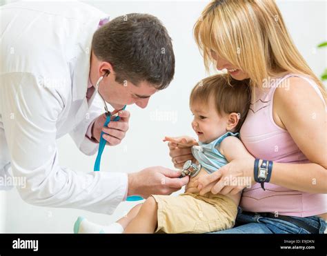 Doctor Examining Kid Patient With Stethoscope Stock Photo Alamy