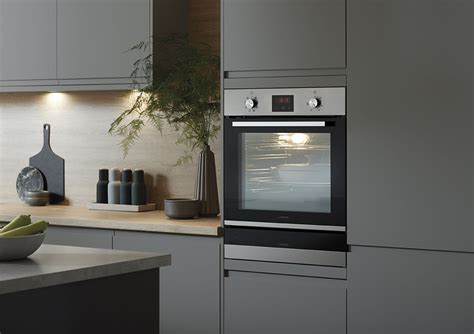 Soft natural cashmere tones on a high gloss kitchen cabinet. Kitchens | Howdens kitchens, Modern kitchen ovens, Kitchen