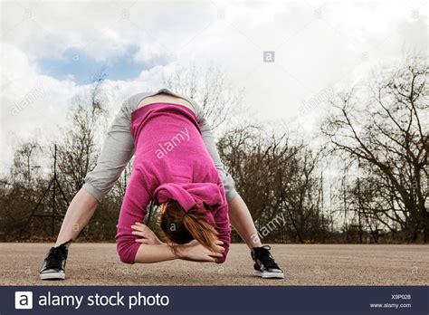 Bending Down High Resolution Stock Photography And Images Alamy