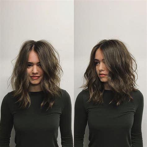 Brunette Layered Cut With Messy Wavy Texture And Center Part The