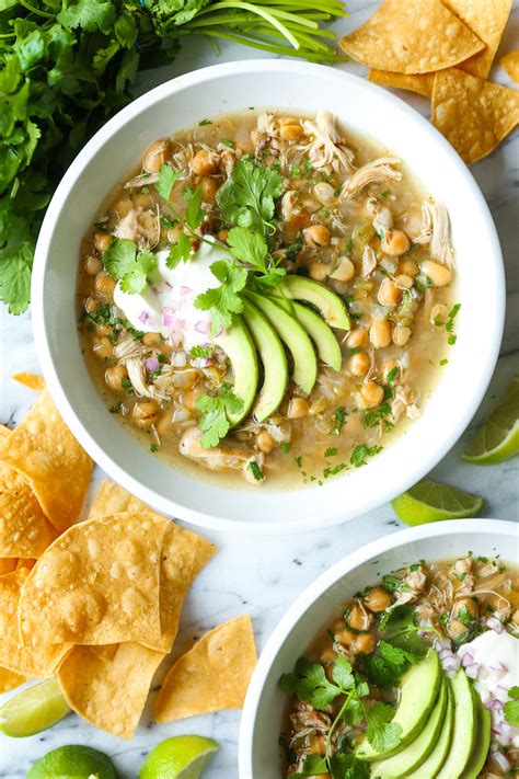 This creamy and mildly spicy slow cooker chicken chili is our family's staple dinner recipe. Slow Cooker White Chicken Chili - Damn Delicious