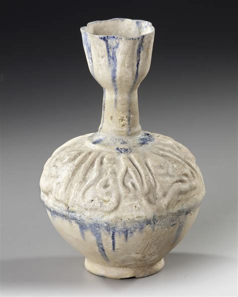 a kashan moulded bottle vase persia 12th century