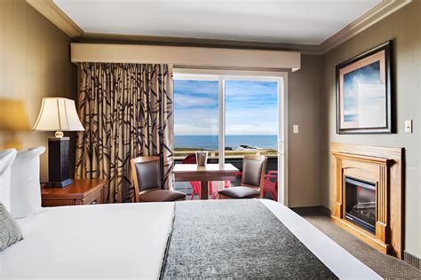 A suite with extra room for folding couch. King Whirlpool Tub with Ocean View Upstairs Room at The ...