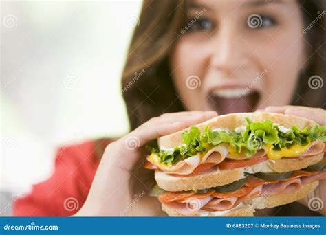 Girl Eating A Bratwurst Sausage Stock Photography