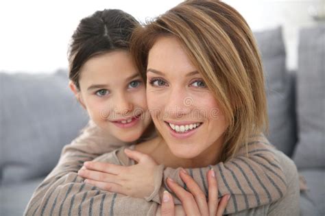 Portrait Of Little Girl Hugging Her Mother Stock Photo Image Of Eyes