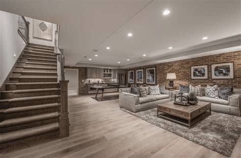 A Finished Basement With A Rustic Straight Staircase And Hardwood