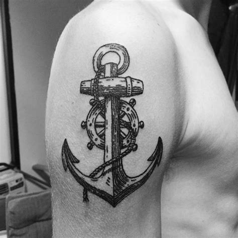 Black Anchor And Ship Wheel Tattoo On The Upper Arm Ship Wheel Tattoo