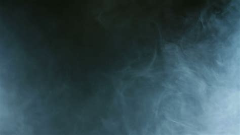 Blue smoke on black background. Cigarette smoke. Smoke effect. Fog background. Abstract smoke 