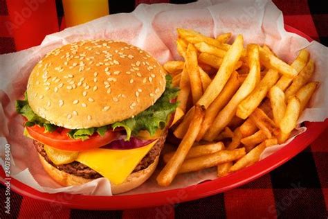 Burger And French Fries In Basket On Tartan Tablecloth Ketchup And