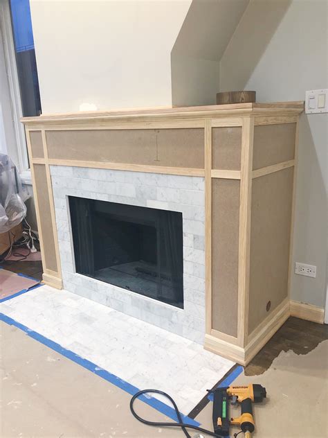 A Fireplace Being Built In The Middle Of A Living Room With No One