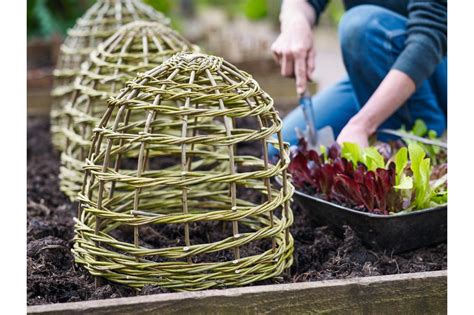 Learn how to build a herb spiral garden in 4 easy steps! Make your own plant supports and protection