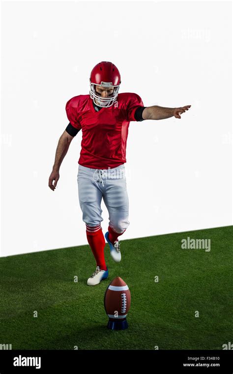 American Football Player Kicking Football Stock Photo Alamy