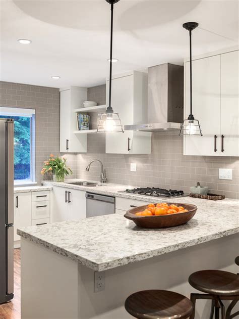 The gold touch adds up the luxuriousness to space! Gray Subway Tile Backsplash | Houzz