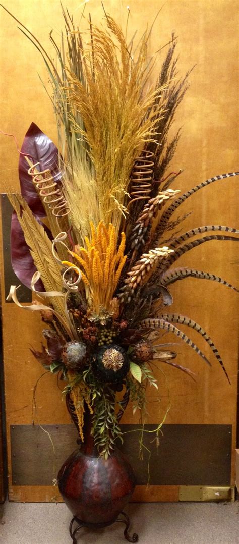 Arcadia's collection of silk florals, permanent botanicals and unique home decor can take any space from standard to special. #Pheasant #feather with #dried flower in metal vase ...