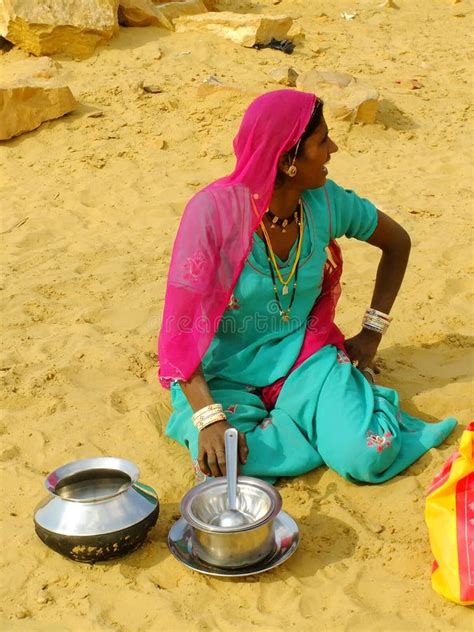 Indian Woman Sitting In A Sand In A Small Village In Thar Desert