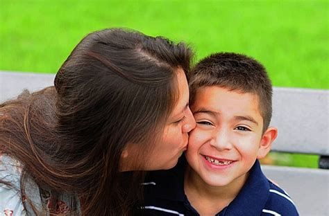 Mom Kissing Young Son On Cheek Kissing Mom Latina Photo Background And