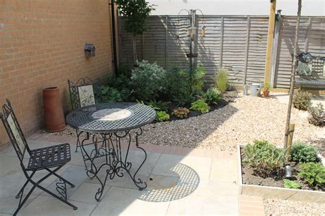 Paved Terrace And Seating Area In This Low Maintenance Small Garden