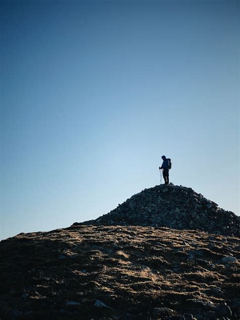 Man Standing On Rocks Photo Free Nature Image On Unsplash