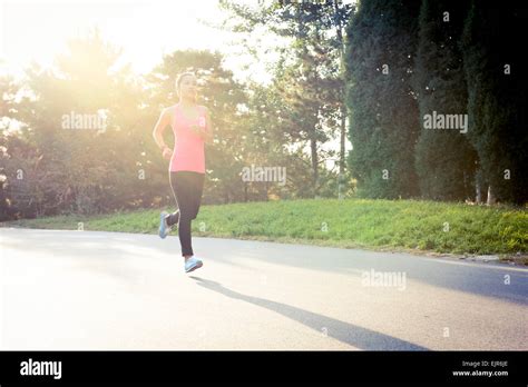 Young Woman Jogging Stock Photo Alamy