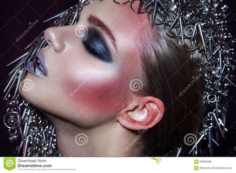 Fashion Beauty Model With Metallic Headwear And Shiny Silver Red Makeup