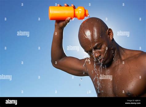 Man Pouring Water Over His Head Stock Photo Alamy