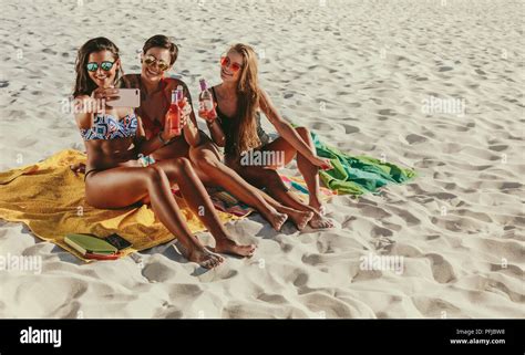 Women On Vacation At A Beach Posing For A Selfie Wearing Sunglasses Three Girlfriends In Bikini