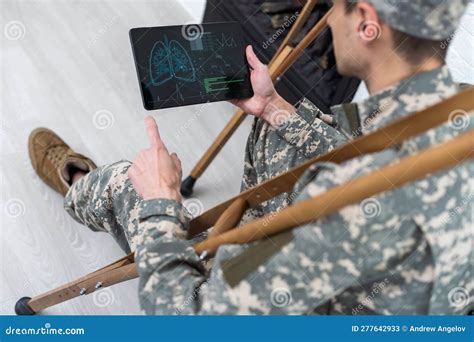 Military Man On Crutches With Tablet Doctor Stock Image Image Of