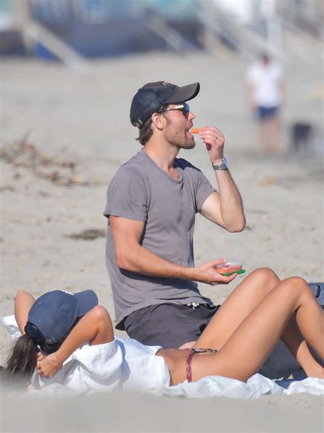 paul wesley in a black cap spends a day out with his wife ines de ramon on the beach in malibu