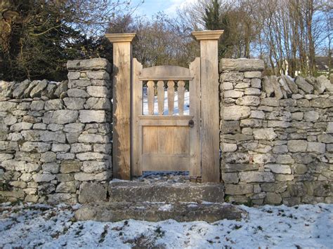 Limestone Wall With Pillars And Oak Gate Cumbria Built By Dry Stone