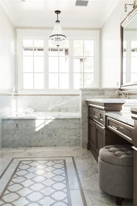 Bathrooms with carrera marble, carrara marble bathroom tile, carrera marble shower, white carrara marble bathroom, small bathrooms with carrara marble, marble bathroom designs, marble bathroom. Brown and Gray Bathroom with Clear Beaded Chandelier over ...